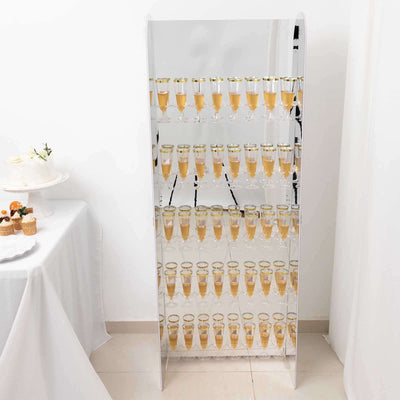 Mirrored champagne tower display with glasses of champagne.