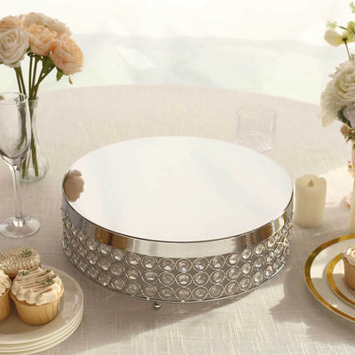 Silver cake stand with crystal accents on a table setting.