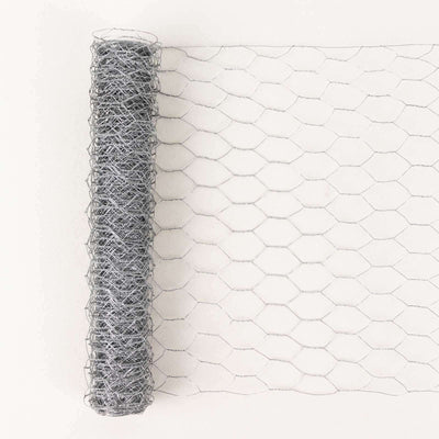 Hexagonal wire mesh roll on a plain background for versatile crafting and fencing use.