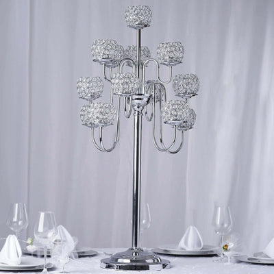 Elegant silver candelabra with crystal candle holders, perfect for formal dining.