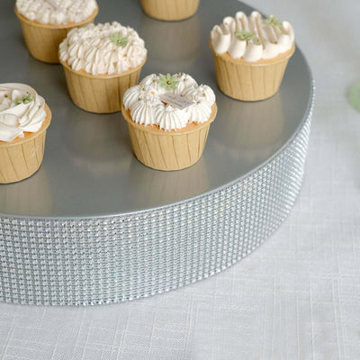 Decorative cupcakes on a silver cake stand.