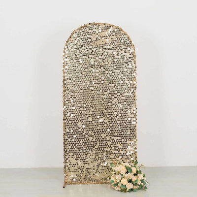 Gold sequin backdrop with floral arrangement, perfect for events and photoshoots.