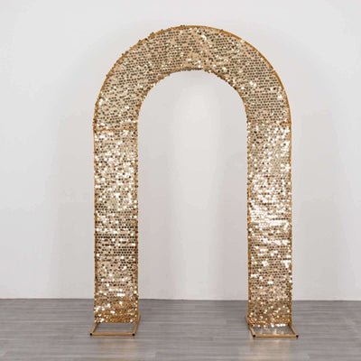 Gold sequin archway decoration for events and celebrations.