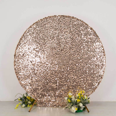 Rose gold sequin backdrop with floral arrangements