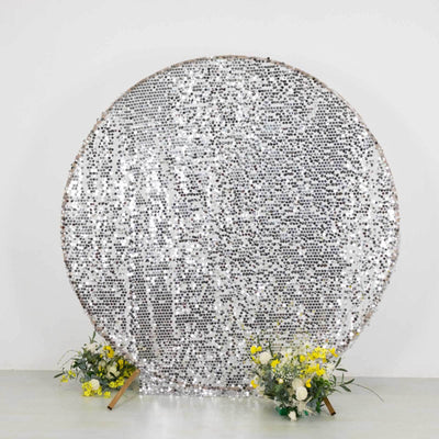 Silver sequin backdrop with flowers in front, perfect for events and photo shoots.