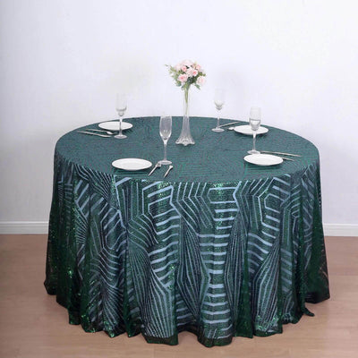 Green sequin tablecloth on a round table set for dining.