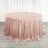 Round rose gold sequin tablecloth draped elegantly on a table.