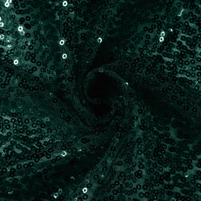 Dark green sequin fabric with a shimmering texture. #whtbkgd