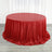 Red sequin tablecloth draped elegantly over a round table.