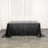 Black sequin tablecloth draped over a table in a studio setting.