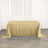Gold sequin tablecloth draped over a table in a bright setting.