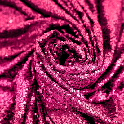Pink sequin fabric with a glossy texture in a swirling pattern. #whtbkgd