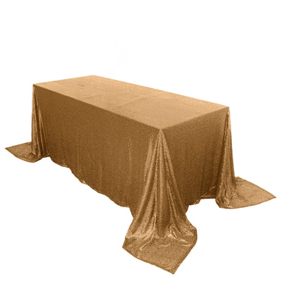 Gold sequin tablecloth draped elegantly over a rectangular table