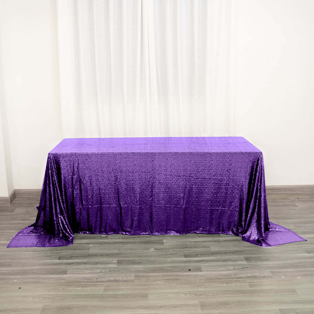 Purple sequin tablecloth draped elegantly on a table.