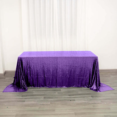Purple sequin tablecloth draped elegantly on a table.