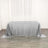 Silver sequin tablecloth on a plain table in a bright room