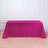 Pink sequin table cover on a plain backdrop.