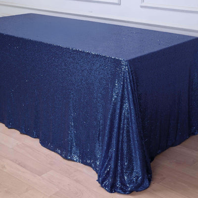 Navy blue sequin tablecloth draping over a table
