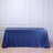 Blue sequin tablecloth draped over a table in a studio setting.