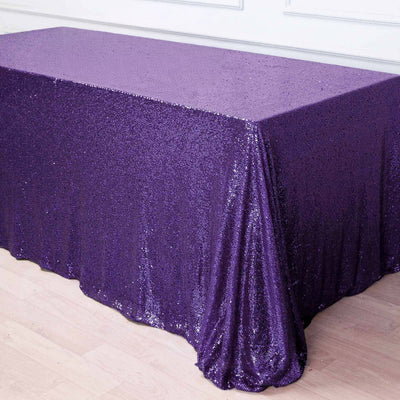 Purple glitter tablecloth draped elegantly on a table.