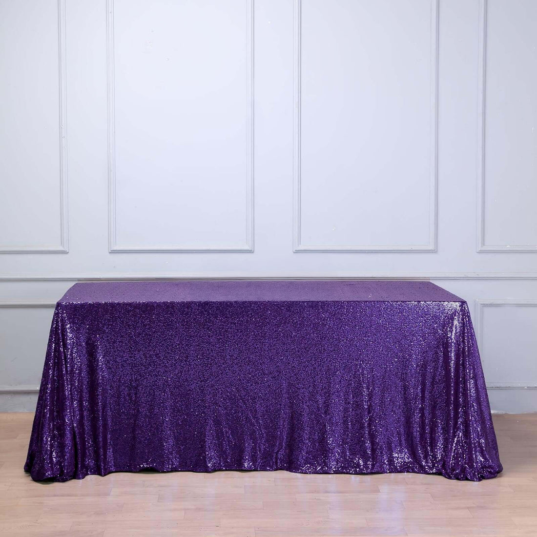 Purple sequin tablecloth draped over a table.