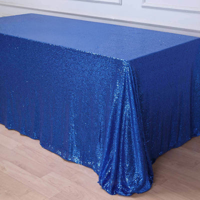Blue sequin tablecloth draped elegantly on a table.