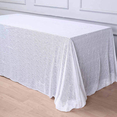 White sequin tablecloth draped elegantly over a table.