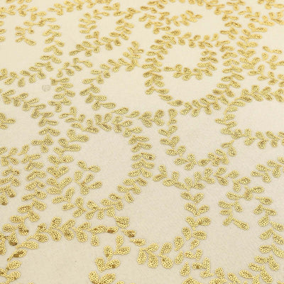 Gold leaf patterned fabric with intricate detailing.