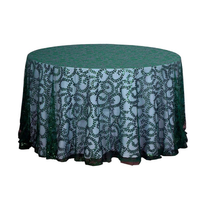 Green round tablecloth with intricate leaf pattern design.