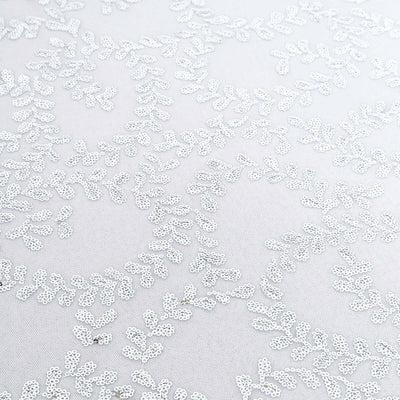 Silver embroidered leaf pattern on a light fabric background.