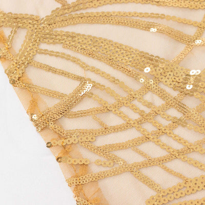 Gold sequin fabric with intricate patterns and textures