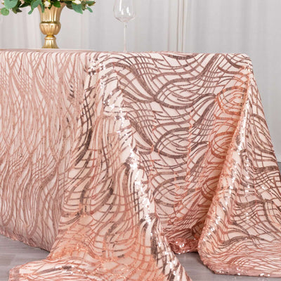 Rose gold sequin tablecloth draped elegantly over a table.