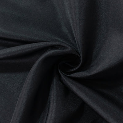 Black fabric with a smooth texture and subtle sheen. #whtbkgd