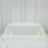 White tablecloth draped elegantly over a table against a plain backdrop.