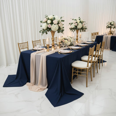 Elegant dining setup with floral centerpieces and gold accents.
