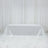 White tablecloth draped over a table on a plain backdrop.