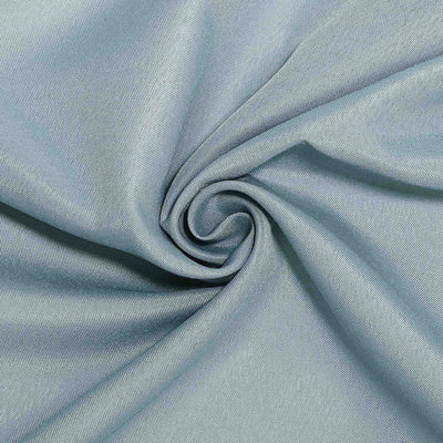 Light blue textured fabric in a spiral pattern.