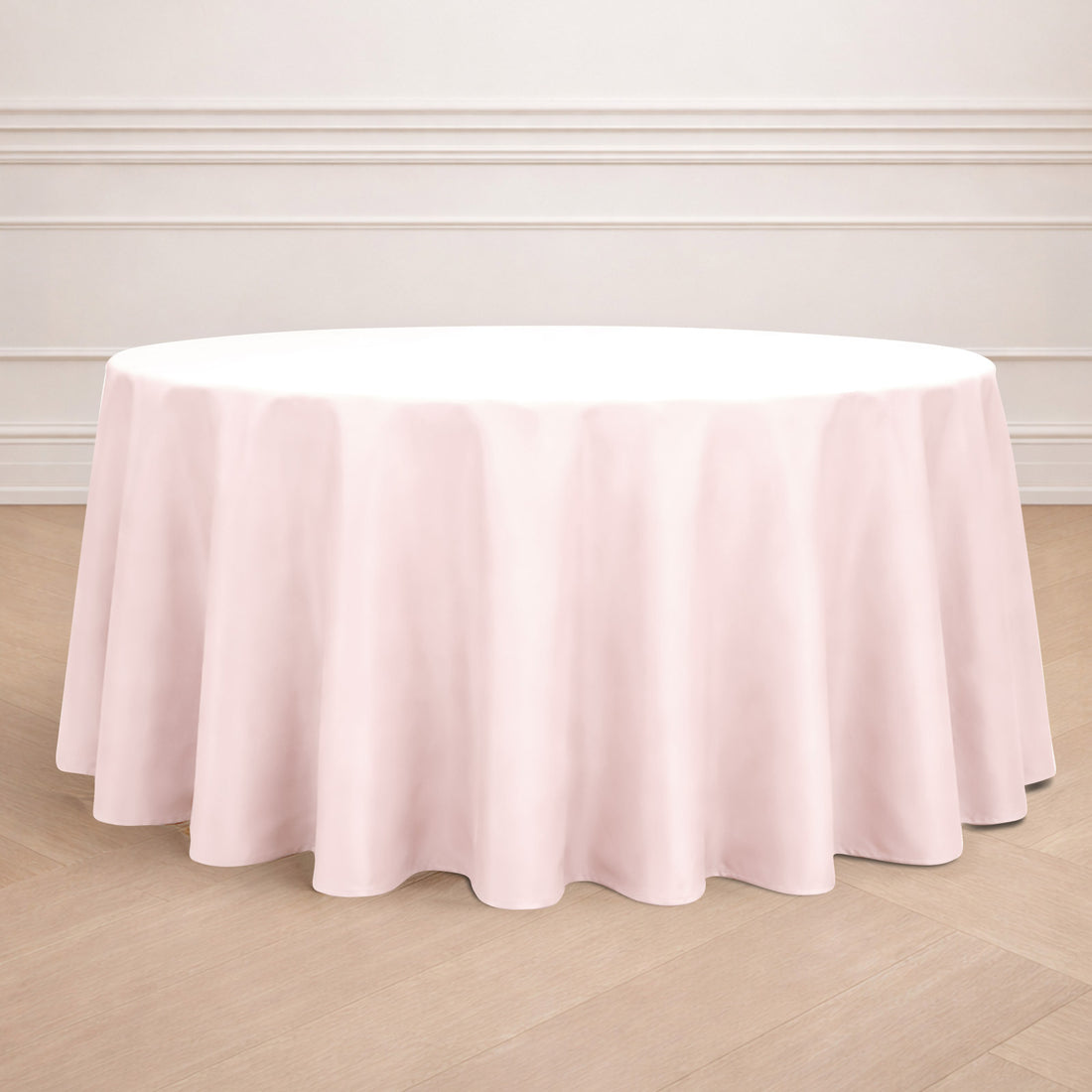 Pink round tablecloth draping elegantly over a table.