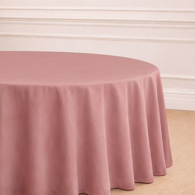 Round pink tablecloth draped elegantly over a table.