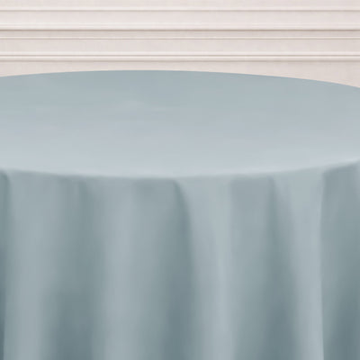 Light blue round tablecloth on a white table