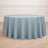 Round blue tablecloth draped over a table in a stylish setting.