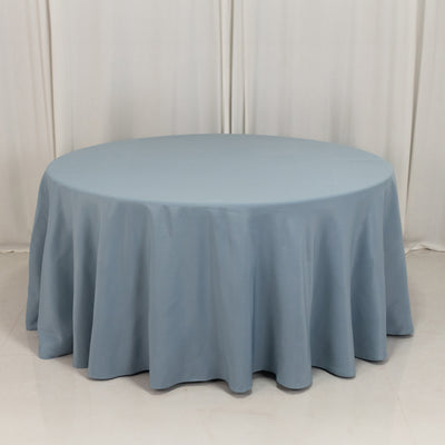 Round blue tablecloth with elegant draping for events and dining.
