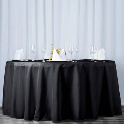 Elegant black tablecloth set for a formal dining experience.