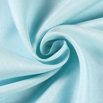 Light blue fabric texture swirl, showcasing softness and quality.
