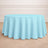 Round light blue tablecloth on a circular table in a bright room.