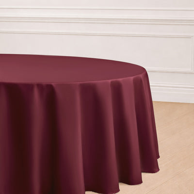 Burgundy round tablecloth draped elegantly on a table
