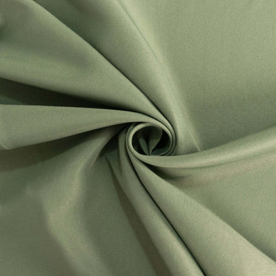 Green fabric texture showcasing smooth, draped material.