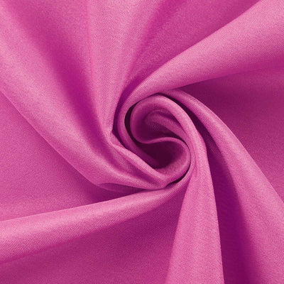 Pink fabric texture in a swirling pattern.