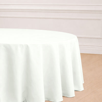 White round tablecloth draped over a table in a stylish setting.