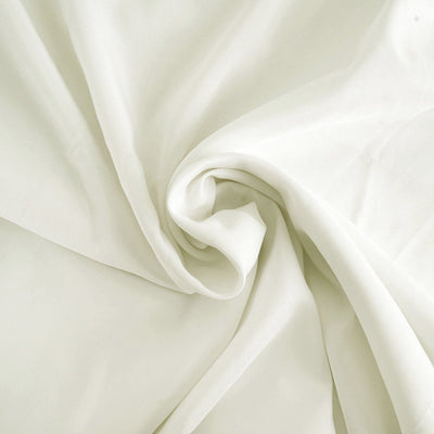 Soft white fabric with elegant drape and smooth texture.